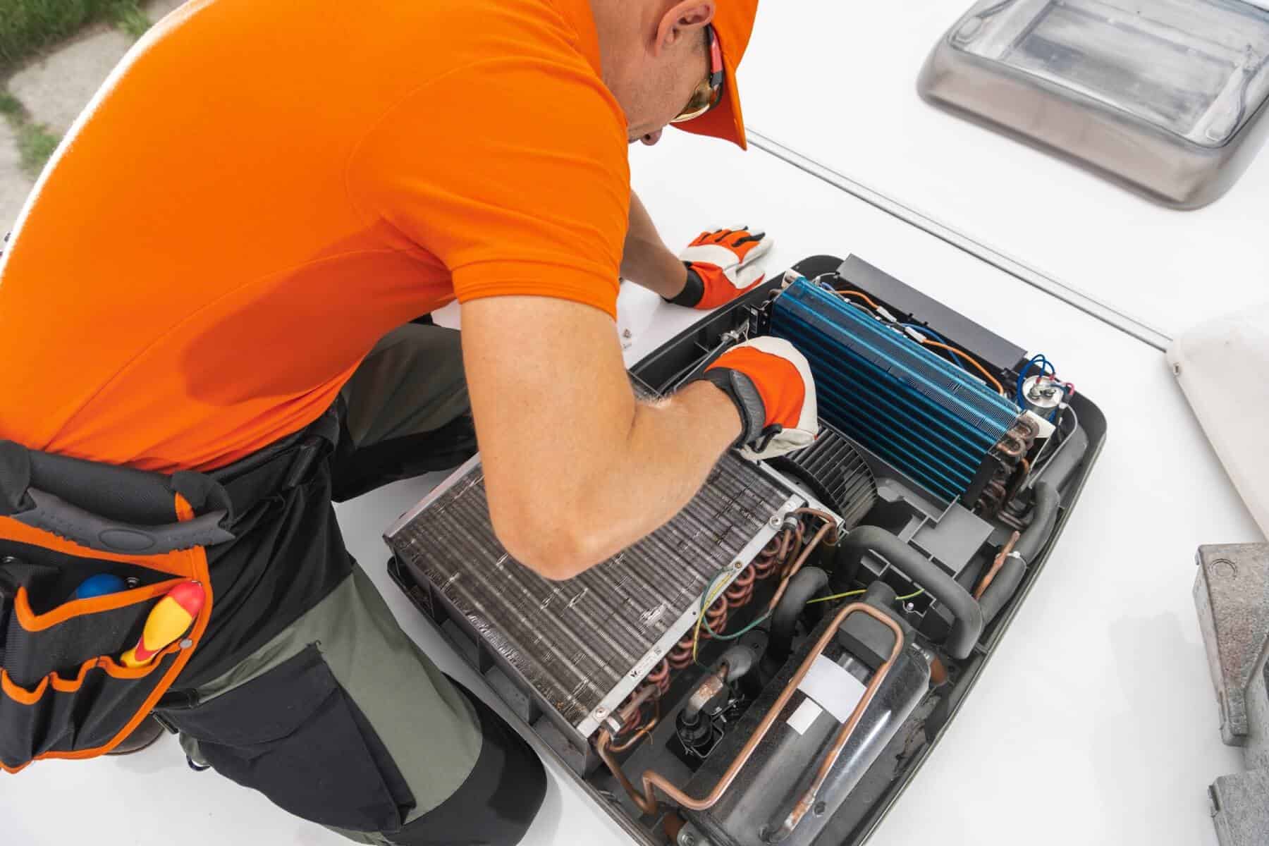 Rv Technician Focused on Servicing Rooftop Ameristrong